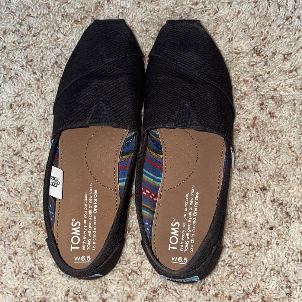 Gently worn black Toms
